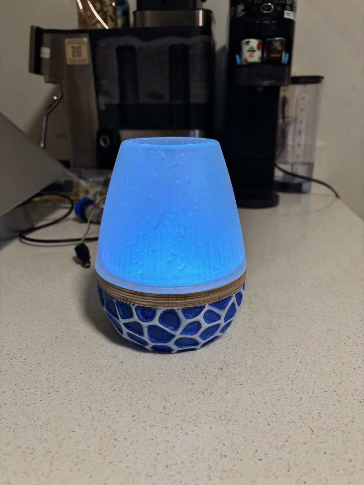 Lamp glowing blue in a kitchen setting