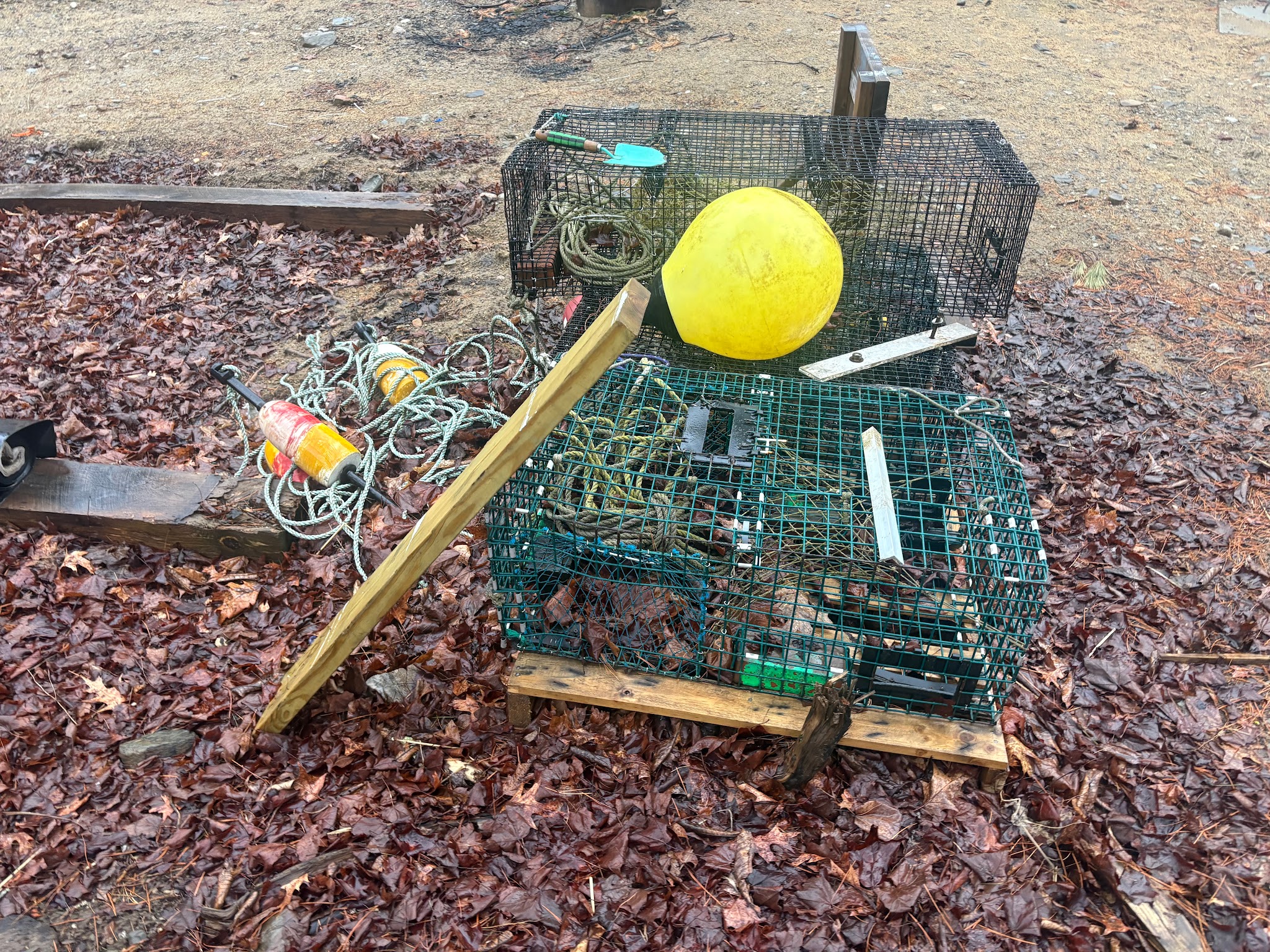 Lobster traps and buoys at a house in Maine