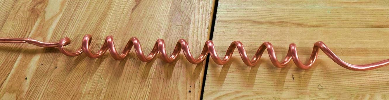 Progression of handmade copper coils